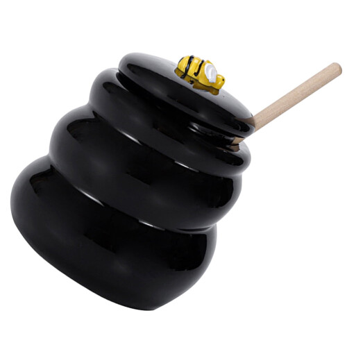 Keramische honingpot met houten deksel.