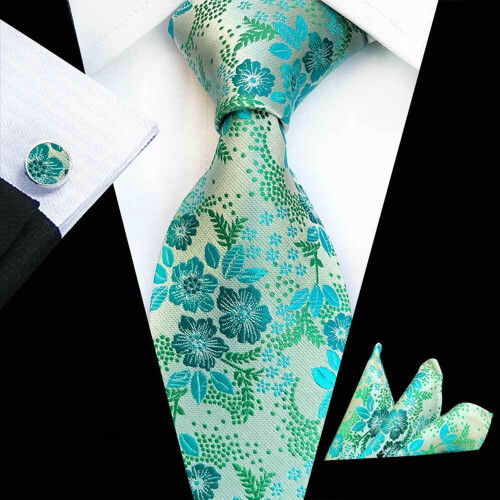 Conjunto masculino com gravata, lenço de bolso e abotoaduras com estampa floral.