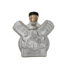 (A) Botella de whisky con forma de motor, cabeza de dragón, vaso de whisky, decantador de whisky, ex