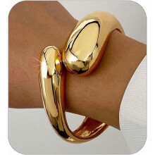 Gouden armband voor dames, verstelbaar, robuust en gedraaid.