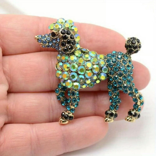 Broche de cachorrinho em bronze com diamante e formato de laço. 1