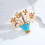 Broche panier de fleurs émaillée ornée de cristaux et de perles 5