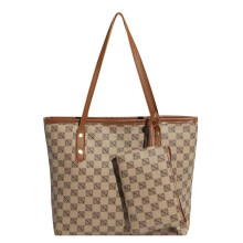 Vintage-Tragetasche mit Print in Khaki, geräumig und vielseitig als Schultertasche für Alltag und Pendeln.