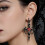 Boucles d'oreilles pendantes chics en forme d'aile de 4