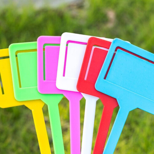 Two yellow plastic insert tags for selling garden plants. 2