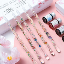 Stylo calligraphique en verre orné d'un motif de fleurs séchées