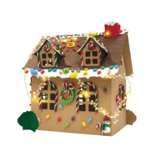 Kit para construir una casa de jengibre de madera (para armar uno mismo) con pinturas y pinceles.