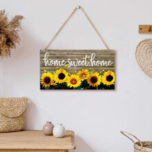 Houten welkomstbord met zonnebloem voor de deur