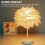 Lampada da tavolo con base in legno e piuma bianca 4