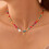 Collier ras du cou à perles dorées avec initiale pour femme 1