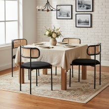 Black 4-Piece Velvet Dining Chairs, modern rattan style with sturdy metal legs for indoor use.