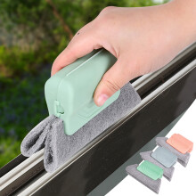 Cepillo para limpiar ventanas con almohadilla abrasiva extraíble, color verde.