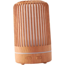 Diffusore di aromi e umidificatore con effetto legno, funzionamento silenzioso e luce LED colorata.
