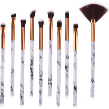 Ensemble de 10 pinceaux de maquillage à motif marbre, en poils synthétiques, pour usage professionnel et personnel.