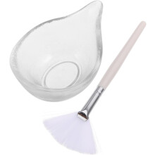 Gesichtsmasken-Mischschalen-Set, bestehend aus einer Glasschale für Serum und einem fächerförmigen, flachen Gesichtsmaskenpinsel.