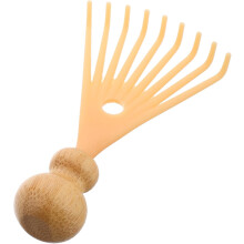 Kopfmassagegerät mit Kamm und manuellem Haarpeeling für tiefe Entspannung. Zur Anwendung unter der Dusche, um Stress abzubauen.