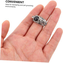 Duurzame metalen trimschaar met staartvormige nagel en drakenkopdesign, inclusief vingersteun.