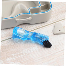 Mini contenitore in plastica per protesi dentarie con spazzolino e specchietto, facile da trasportare per prevenire problemi dentali.