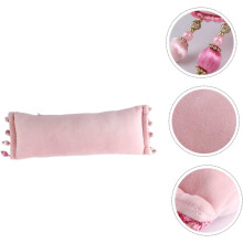 Coussin de manucure en forme de coussin pour ongles, pour un repos confortable des mains et un soutien des poignets en salon de manucure.