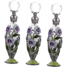3 glazen aromaflesjes voor etherische oliën, elegant ontwerp voor aromatherapie in huis, stijlvolle decoratie voor op het bureau.