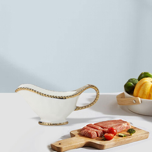 Saucière en porcelaine blanche à bordure dorée 1
