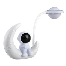Lampada da scrivania a LED ricaricabile a forma di astronauta dei cartoni animati con luce lunare.