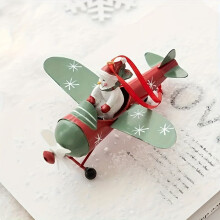 Enfeite de avião vintage de ferro com Papai Noel, boneco de neve e asas estreladas.