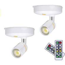 Set di 2 mini faretti wireless a batteria per illuminazione di interni, con luminosità regolabile e telecomando, fissabili ovunque.