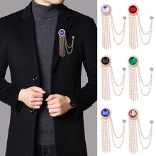 Vintage-style red lapel pin with sparkling chain and tassel