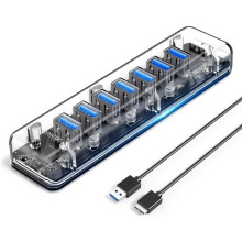 ORICO USB 3.0 -keskitin, 7 läpinäkyvää USB 3.0 -porttia sinisellä merkkivalolla ja kahdella virtaportilla, 1 m USB A-B -kaapeli