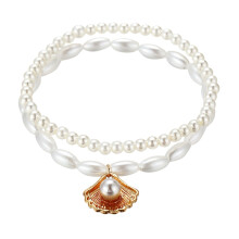 Tobillera bohemia de doble capa para mujer con perlas y conchas marinas.