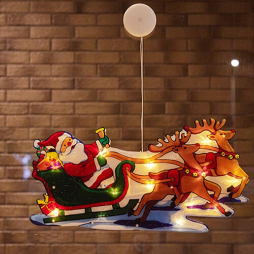 Christmas window decoration with Santa and tree silhouette,