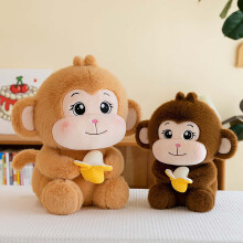 Schattig geel aapje knuffelbeest met banaan