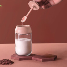 Tarro de cristal rosa para condimentos con tapa hermética y cuchara.
