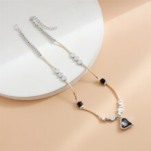 Collier pendentif coeur asymétrique bicolore en or et argent
