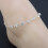 Tornozeleira feminina com strass prateado, ajustável. 1