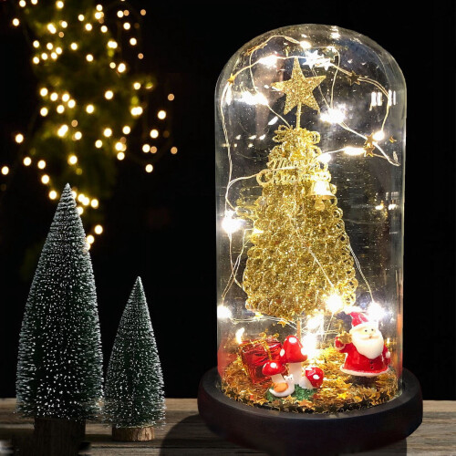 Mini árvore de Natal decorativa com luzes LED em vidro dourado.