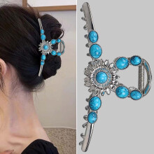Pinza para el cabello de metal estilo western con forma de sol, color turquesa.