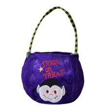 Halloween-karkkipussi kurpitsa karkki-tai-keppiämpäri