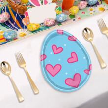 Set di stoviglie a tema uova di Pasqua: piatti e tovaglioli di carta colorati.