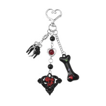 Charme porte-clés noir élégant avec motif d'os audacieux et-UN