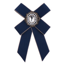Broche de lazo con diamantes de imitación azules (1 pieza)