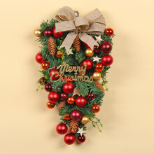 Karácsonyi könnycsepp alakú ajándék műbogyókkal és piros színnel