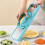 Double-Door Grater/Shredder, Multi-Functional Kitchen Tool for Shredding, Slicing, and Cutting Vegetables. 3