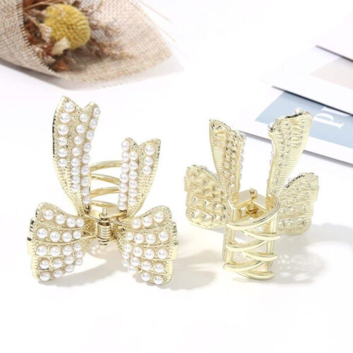 Unicra gouden parelhaarclips, strikjes, set van 2 1