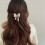 Unicra gouden parelhaarclips, strikjes, set van 2 4