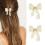 Unicra gouden parelhaarclips, strikjes, set van 2 1