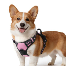 Arnés reflectante rosa ajustable para perros, chaleco antitirones con clip frontal y gancho para correa para paseos y senderismo.