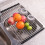 Foldable stainless steel dish drainer over the sink. 2