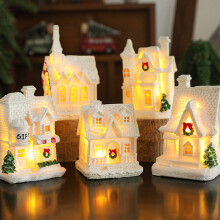 Resin Christmas snow house ornament with warm yellow light